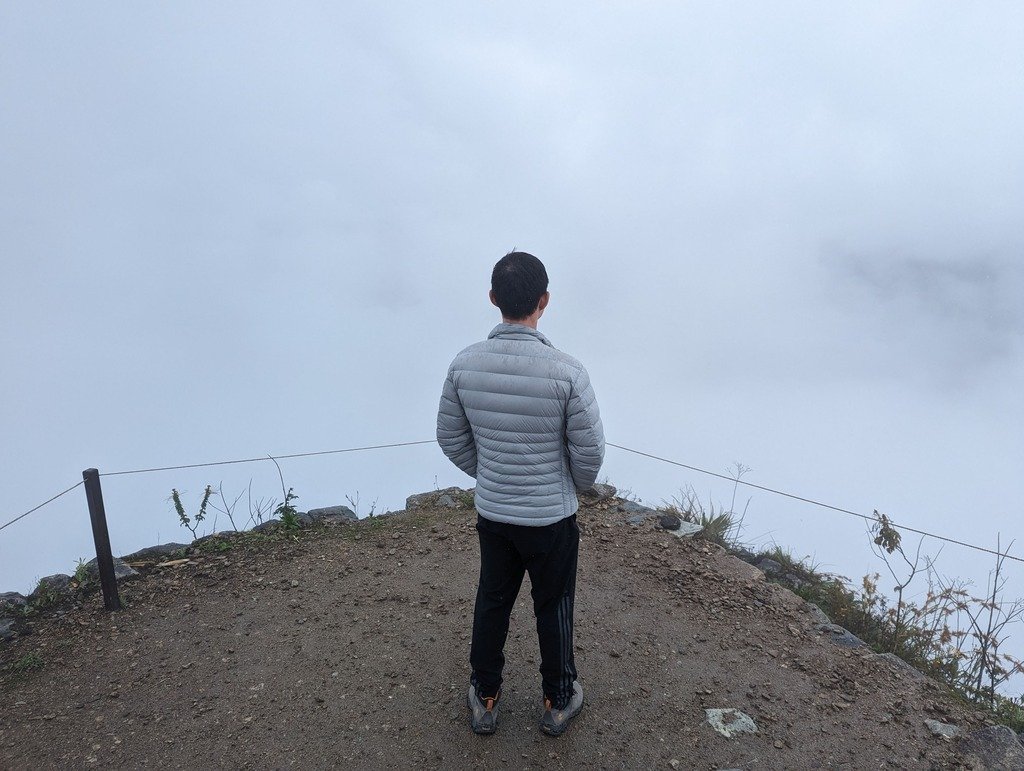 Top of Machu Picchu mountain on a cloudy day